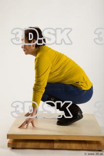 Kneeling reference of yellow sweater blue jeans Gwendolyn 0003